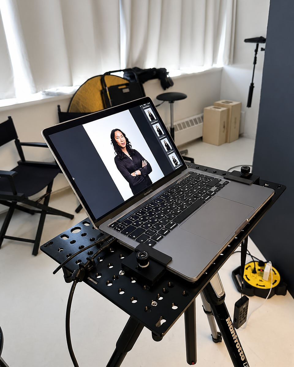 Tethered capture digikit station with mounted screen, laptop tray, cables, and studio setup for a photo shoot workflow
