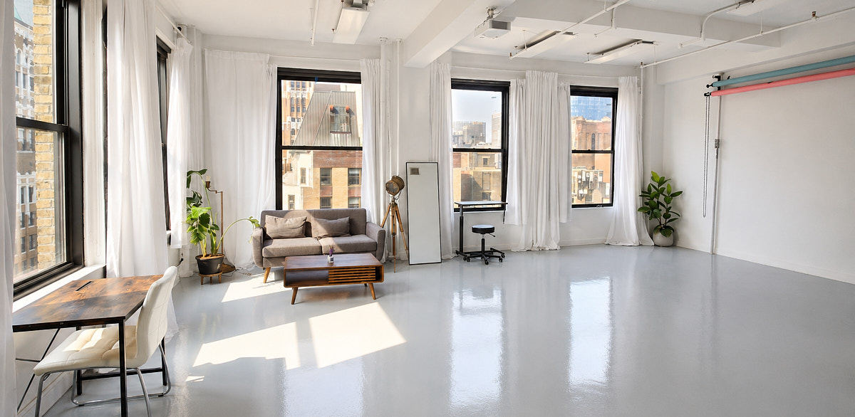 Natural-light studio lounge and shooting area used for a fashion lookbook production