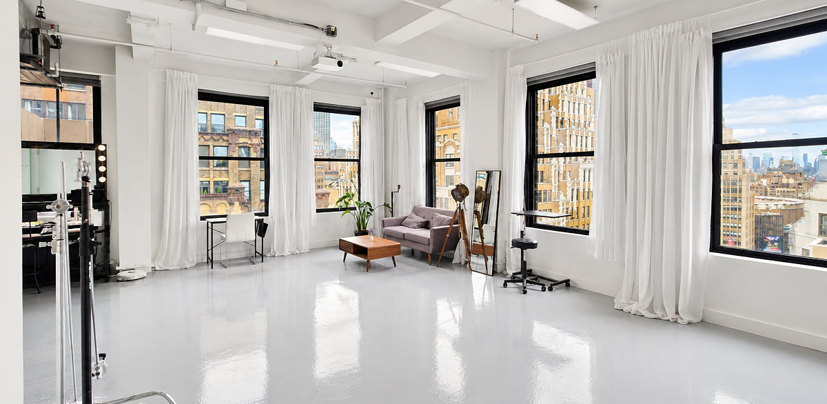 Studio 1720 large white production space with lounge seating, natural window light, and open floor for studio rentals