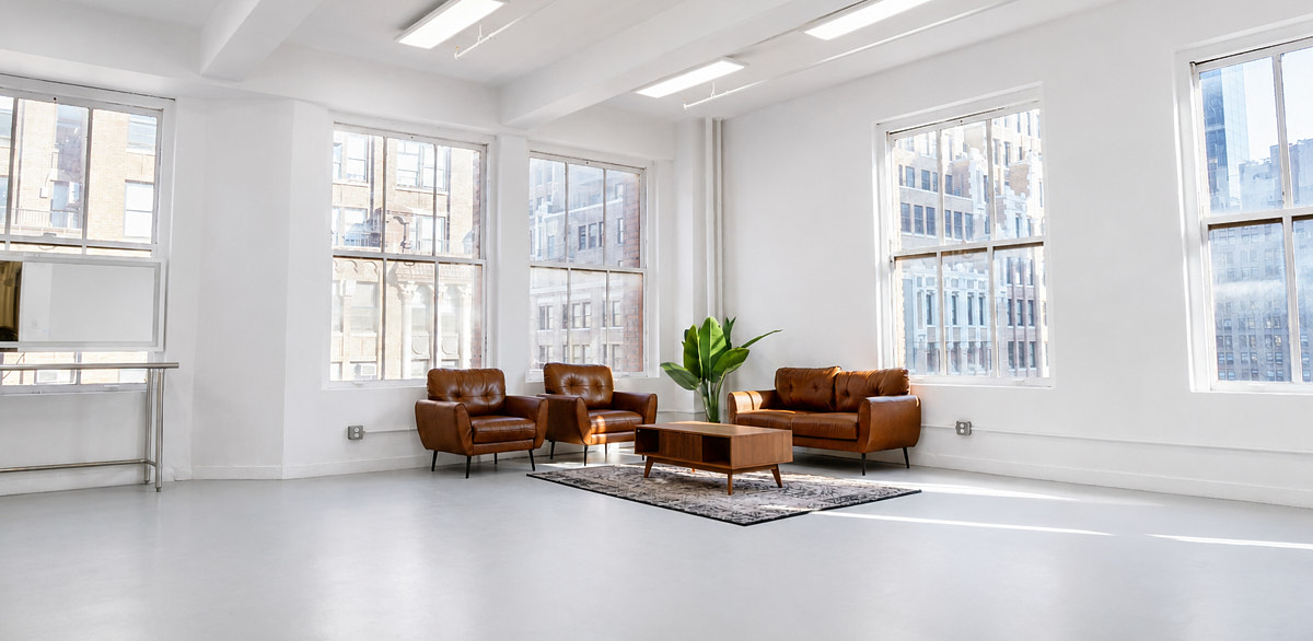 Studio 2110 natural-light photo studio with open white floor, large windows, and flexible setup for productions