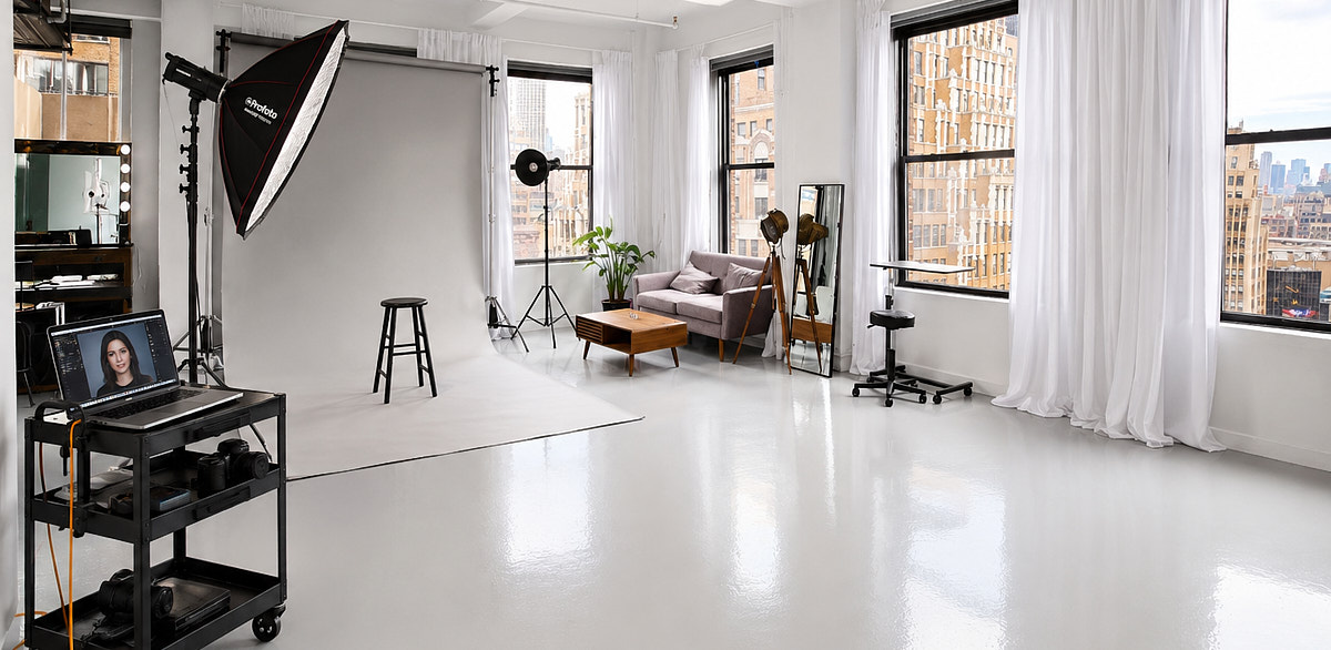 Beauty and fashion photo setup inside Match Studios NYC with lighting equipment, white curtains, and open shooting area